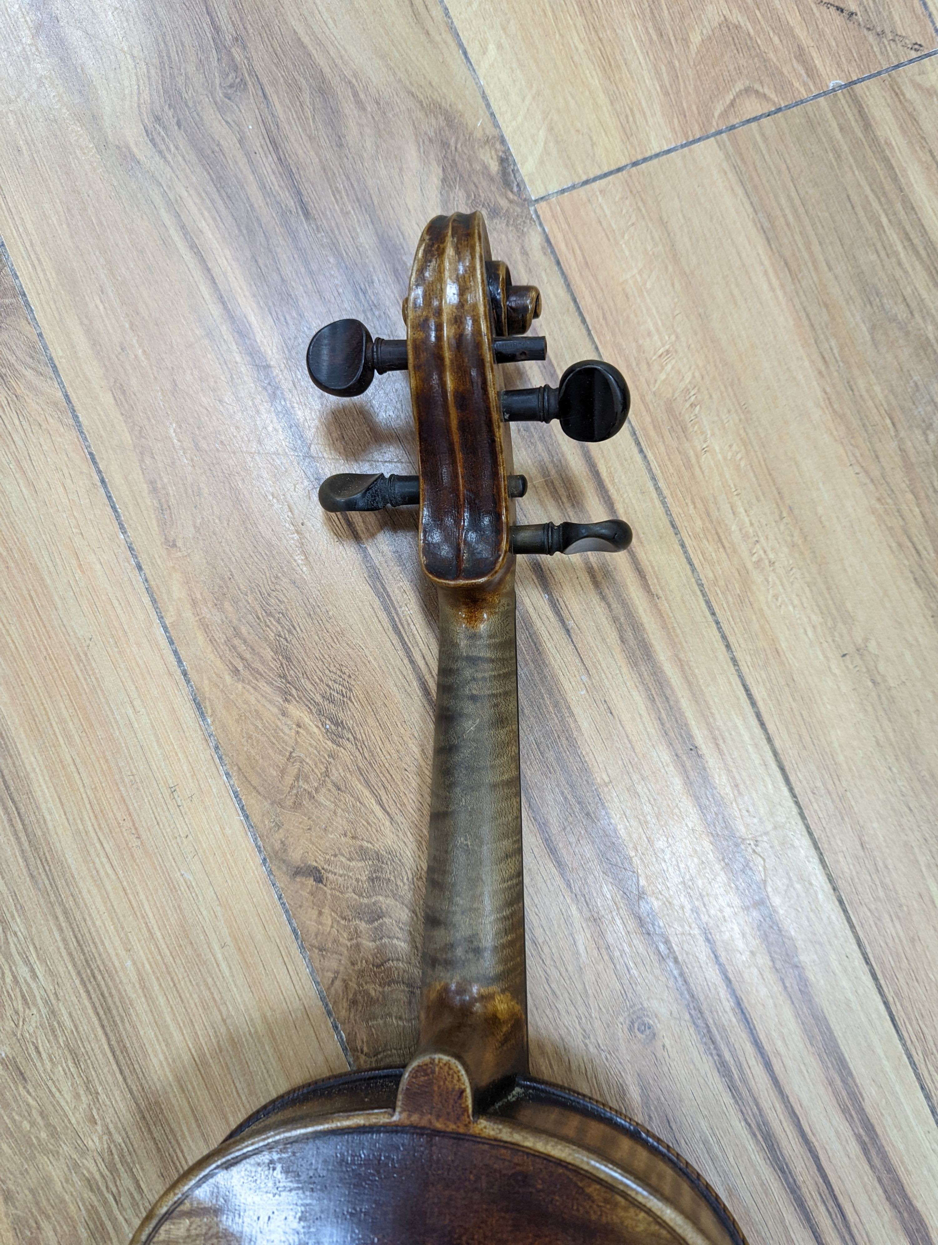 A late 19th century German violin, case, 60 cms long.
